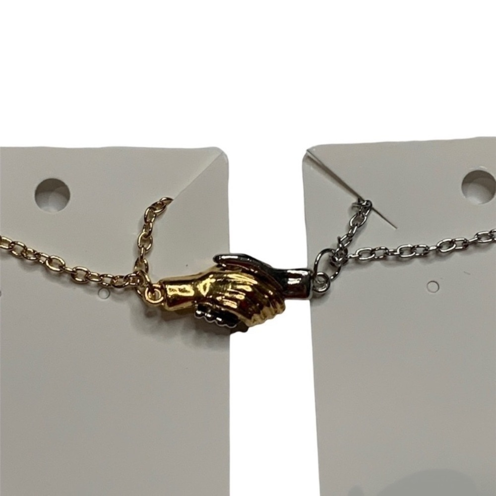 Matching holding hands necklace